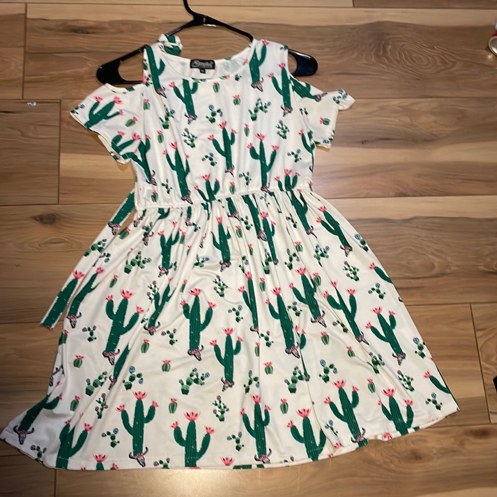 Barely ever worn! Great little dress for just about anything. Youth extra large